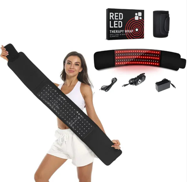 Woman holding a large black Black LED Infrared Belt Therapy Wrap with additional components on a white background