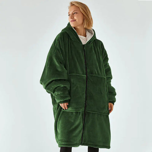 Person wearing a green fleece blanket coat on a white background