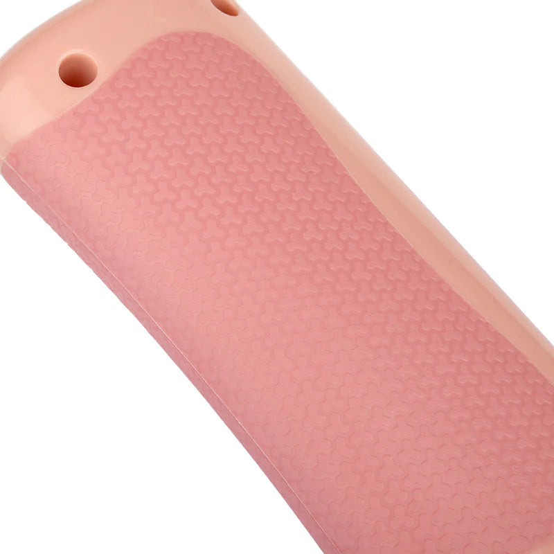 Close up of a Pink Pet Grooming Comb on a white background