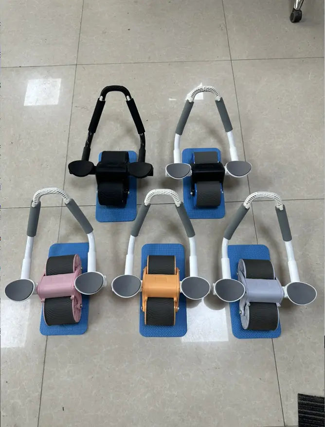Set of five Automatic Rebound Abdominal Wheels on a tiled floor