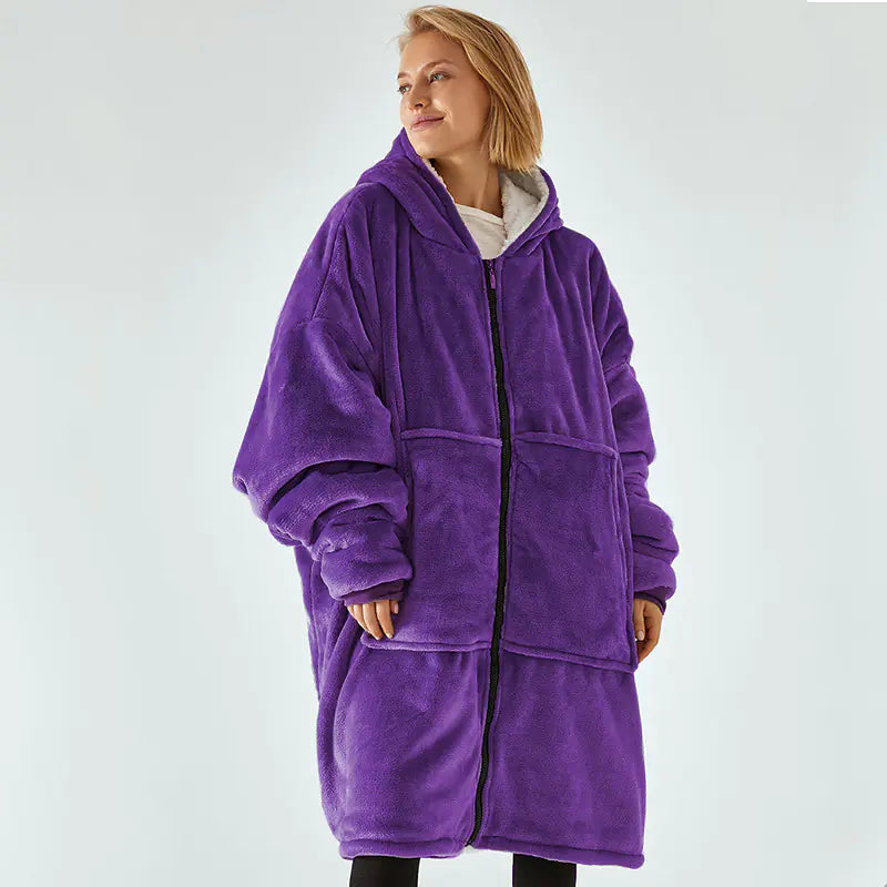 Person wearing a purple fleece robe on a white background