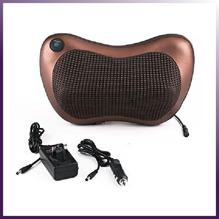 Brown massage pillow with power adapter on a white background