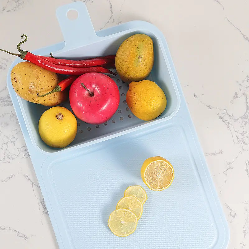 Multifunctional Sink Chopping Board Drain Basket basket with fruits and vegetables on a marble surface