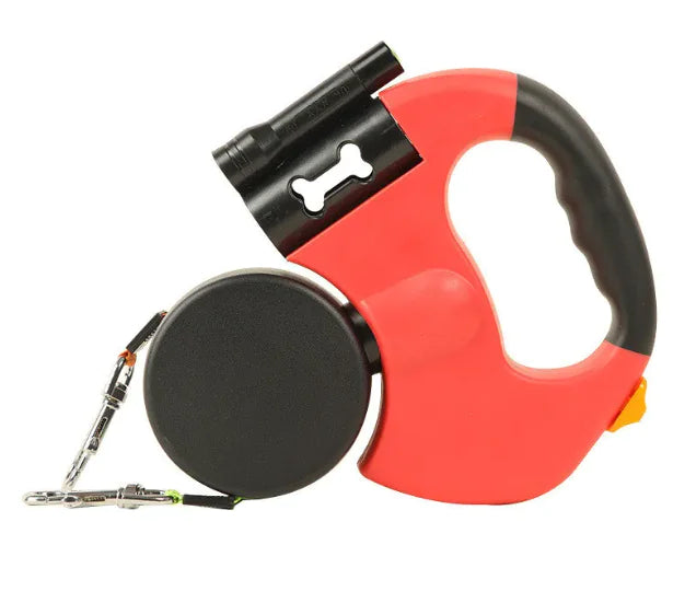 Red and black Auto Double Dog Leash retractable with a bone-shaped clip on a white background
